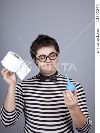 Funny men keeping clyster and toilet paper. Funny men keeping clyster and toilet paper. 13895240