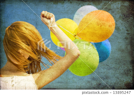 Redhead girl with colour balloons at blue sky background. Redhead girl with colour balloons at blue sky background. 13895247