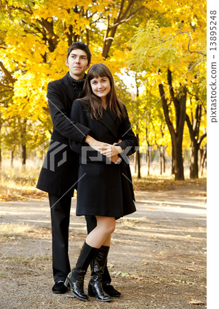 Couple in the park in fall Couple in the park in fall 13895248