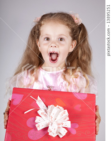 Beautiful young smiling girl with present box Beautiful young smiling girl with present box 13895251