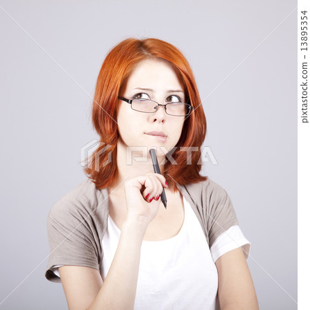 Young businesswomen with pen in hand 13895354