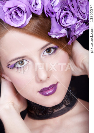 Portrait of beautiful redhead girl with style make-up and flower Portrait of beautiful redhead girl with style make-up and flower 13895574