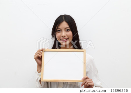 A young lady with a message board A young lady with a message board 13896256