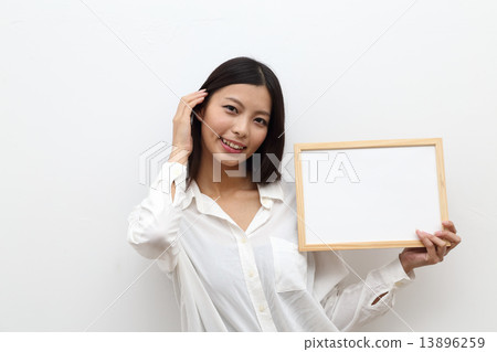 A young lady with a message board A young lady with a message board 13896259