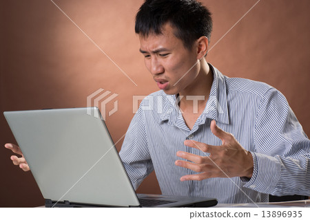Angry business man 13896935