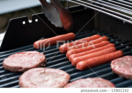 Hot Dogs and Hamburgers on the Grill 13901142