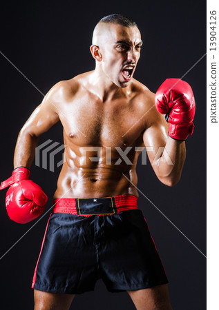 Boxer with red gloves in dark room 13904126