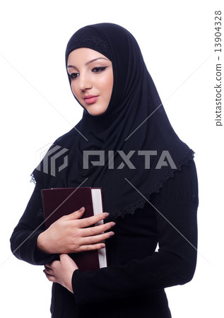 Young muslim woman with book on white 13904328