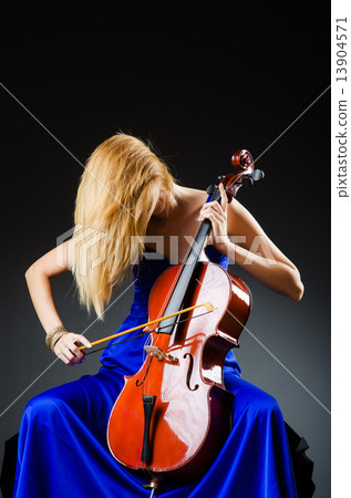 Attractive woman with cello in studio 13904571