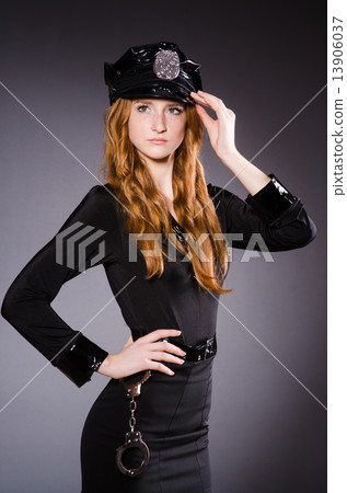 Woman police office in dark room 13906037