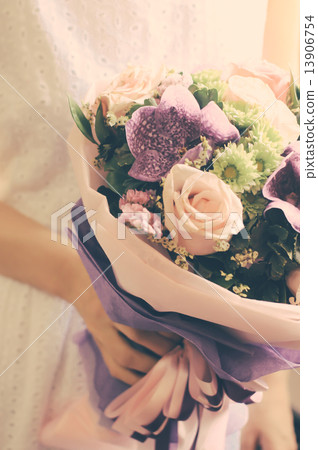 Bride or bridemaid with bouquet of flower, retro filter effect Bride or bridemaid with bouquet of flower, retro filter effect 13906754
