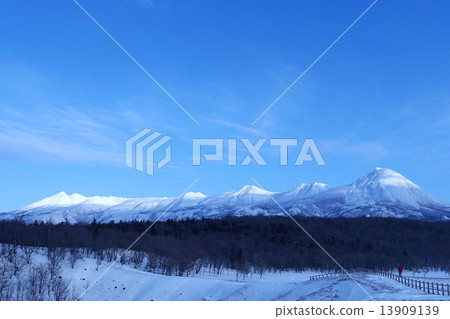 Shiretoko mountain range in winter seen from Flepe waterfall 13909139