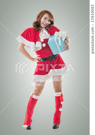 Smile happy Asian Christmas girl hold gift box Smile happy Asian Christmas girl hold gift box 13910083