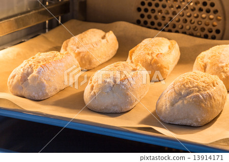 Buns are baked in an oven 13914171