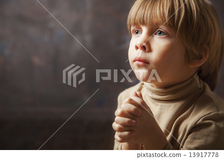 Little young beautiful boy spiritual peaceful praying 13917778
