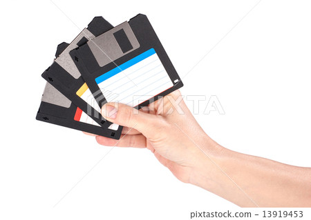 Female hand holding floppy disks Female hand holding floppy disks 13919453