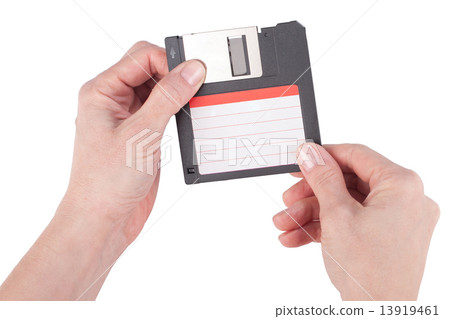 Female hands holding floppy disk Female hands holding floppy disk 13919461