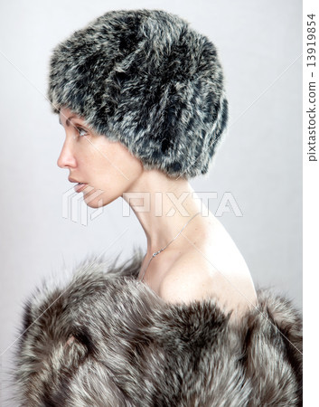 The young beautiful woman in a fur hat 13919854