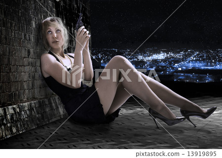 The young woman with the gun on a roof. Night. 13919895