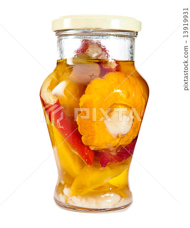 Marinaded bush pumpkins and vegetable marrows in a glass jar.. Marinaded bush pumpkins and vegetable marrows in a glass jar.. 13919931