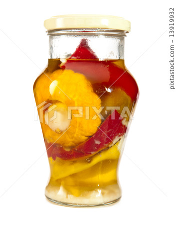 Marinaded bush pumpkins and vegetable marrows in a glass jar.. Marinaded bush pumpkins and vegetable marrows in a glass jar.. 13919932