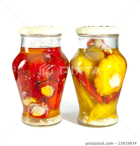 Marinaded tomatoes, stuffed and bush pumpkins and vegetable marrows in a glass jar Marinaded tomatoes, stuffed and bush pumpkins and vegetable marrows in a glass jar 13919934
