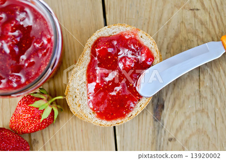 Bread with strawberry jam and berries on board Bread with strawberry jam and berries on board 13920002