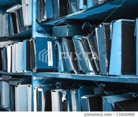 Paper documents stacked in archive 13920966