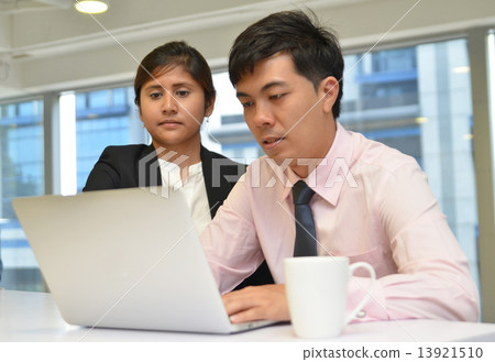 Business people in office meeting to discuss Business people in office meeting to discuss 13921510