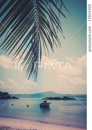Boat on a Tropical beach at Curieuse island Seychelles Boat on a Tropical beach at Curieuse island Seychelles 13924309