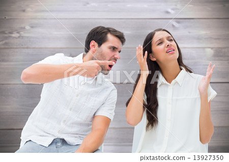 Composite image of couple sitting on chairs arguing 13927350