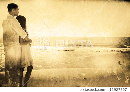 Composite image of attractive couple looking out at sea Composite image of attractive couple looking out at sea 13927897