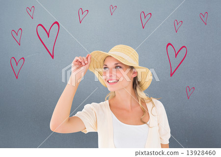 Composite image of attractive young blonde smiling in sunhat 13928460