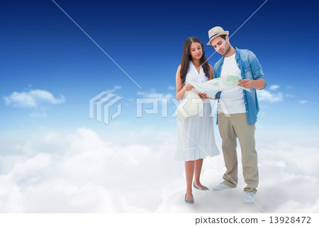 Composite image of lost hipster couple looking at map Composite image of lost hipster couple looking at map 13928472
