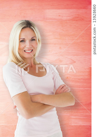 Composite image of happy blonde smiling with arms crossed 13928660