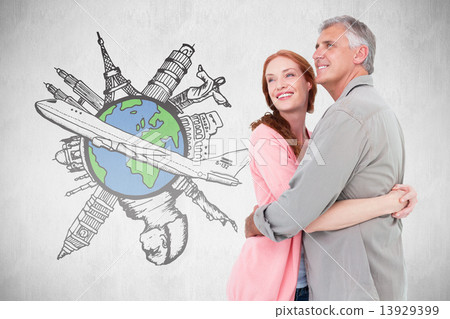 Composite image of casual couple hugging and smiling Composite image of casual couple hugging and smiling 13929399