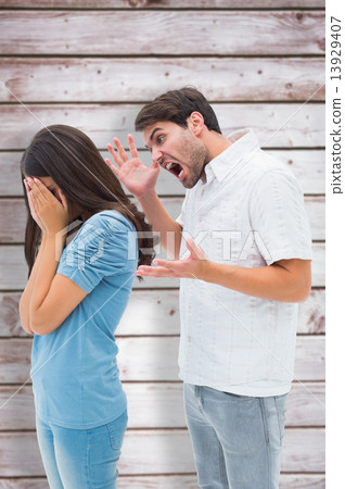 Composite image of angry man shouting at girlfriend Composite image of angry man shouting at girlfriend 13929407