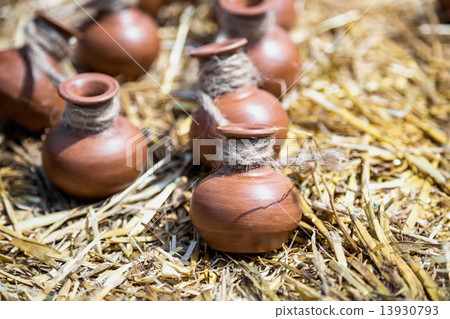 Small ceramic crocks or pot on straw 13930793