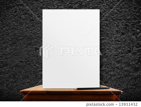 blank poster frame on wood table at black stone wall,perspective blank poster frame on wood table at black stone wall,perspective 13931432