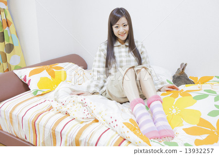 A woman wearing a finger-worn sock A woman wearing a finger-worn sock 13932257
