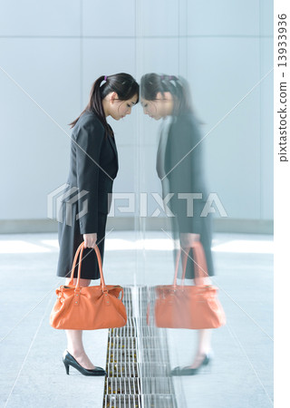 One young chinese businesswoman having a bad day at work 13933936