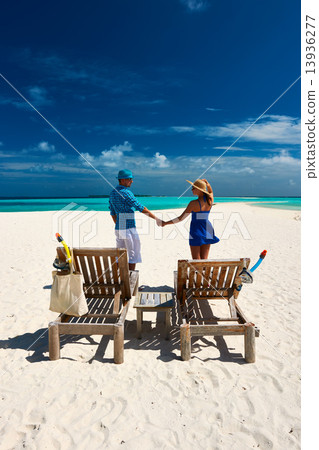 Couple in blue on a beach at Maldives 13936277