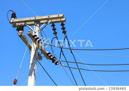 Electrical wire on pole. chaotic wire with nest on pole and blue sky background Electrical wire on pole. chaotic wire with nest on pole and blue sky background 13936460