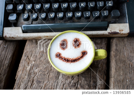 Happy coffee cup and Vintage typewriter on wooden background. Happy coffee cup and Vintage typewriter on wooden background. 13936585