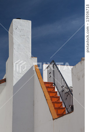 Detail of white house under blue sky 13936718