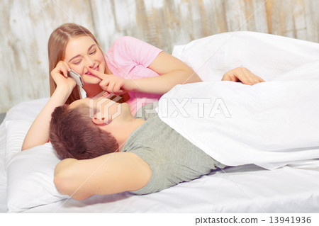 Beautiful young couple in bed Beautiful young couple in bed 13941936