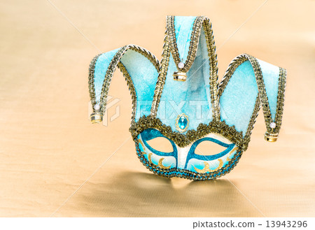 Venetian carnival mask harlequin on golden background 13943296