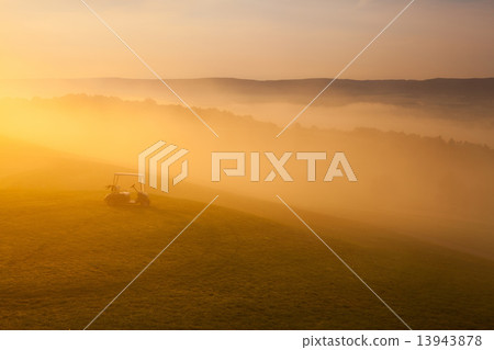 Green golf cart on the empty golf course 13943878