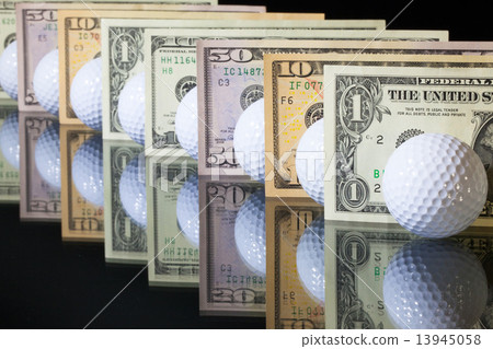 Golf balls and US dollars banknotes Golf balls and US dollars banknotes 13945058