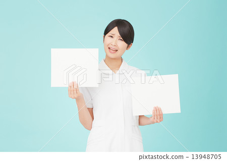 Embarrassed nurse with two message boards 13948705